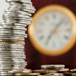 selective focus photo of stacked coins