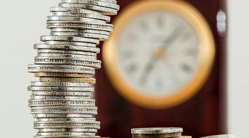 selective focus photo of stacked coins