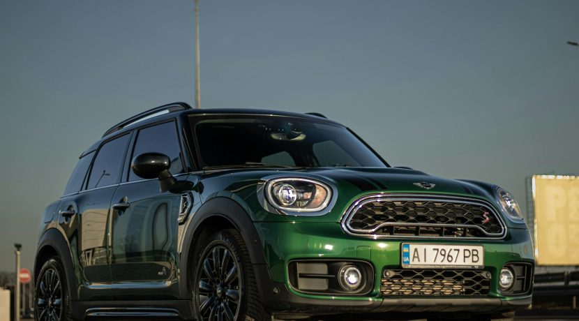 front of a green mini cooper