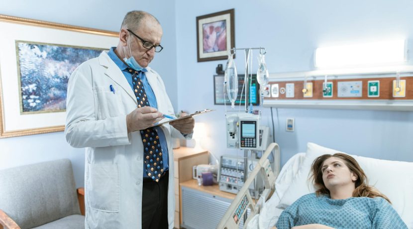 a physician in white coat checking up on his patient